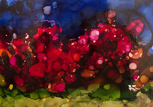An alcohol ink painting with bright red hues