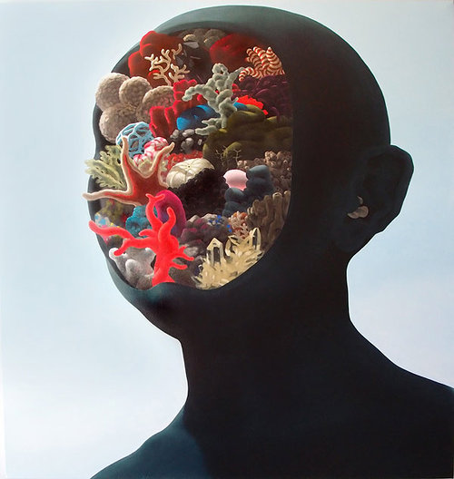 painting of black head with sea coral inside