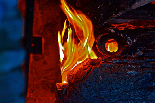A manipulated photo of a flame emerging from a structure