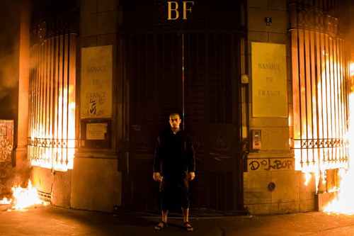 A photo of Pyotr Pavlensky in front of a Paris bank shortly before being arrested