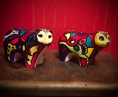A pair of painted bear figurines