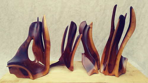 A series of sculptures with tall vertical lines