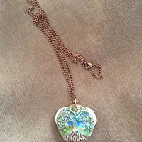 Tree of life pendant with peridot crystals //images.artistrunwebsite.com/gallery/img_1898121464741072_large.jpg?1477018792