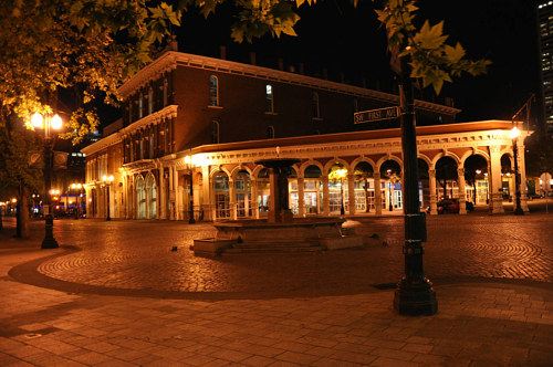 A photograph of a deserted street at night