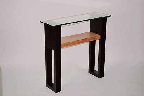 A small console table made from wenge and western curly maple