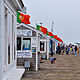 flags on the pier by Lisa Kane