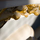 Gilded decorative elements found below the windows of the lantern by Mike Steinhauer