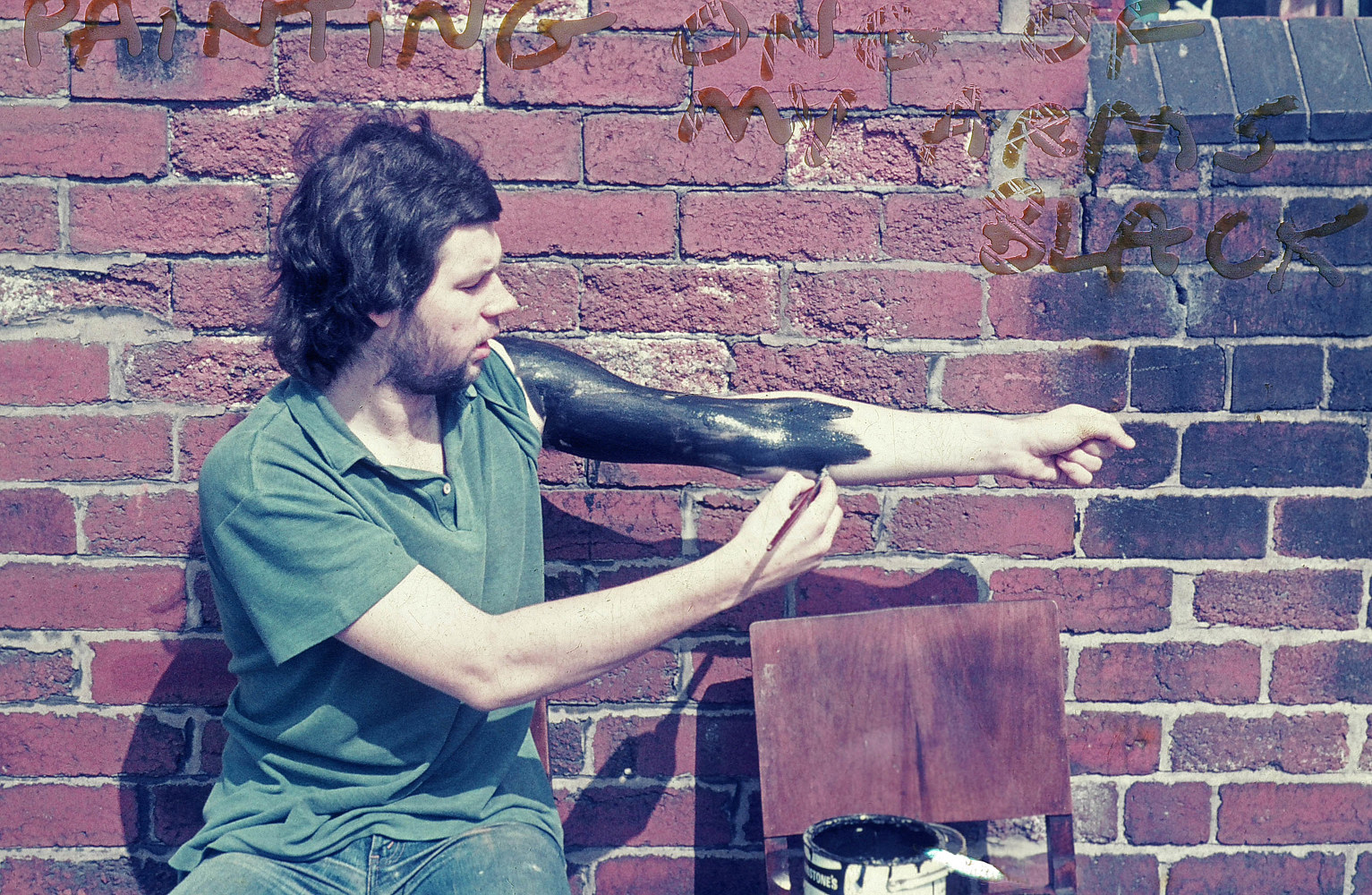 Painting one arm black 2 by Ron Crowcroft