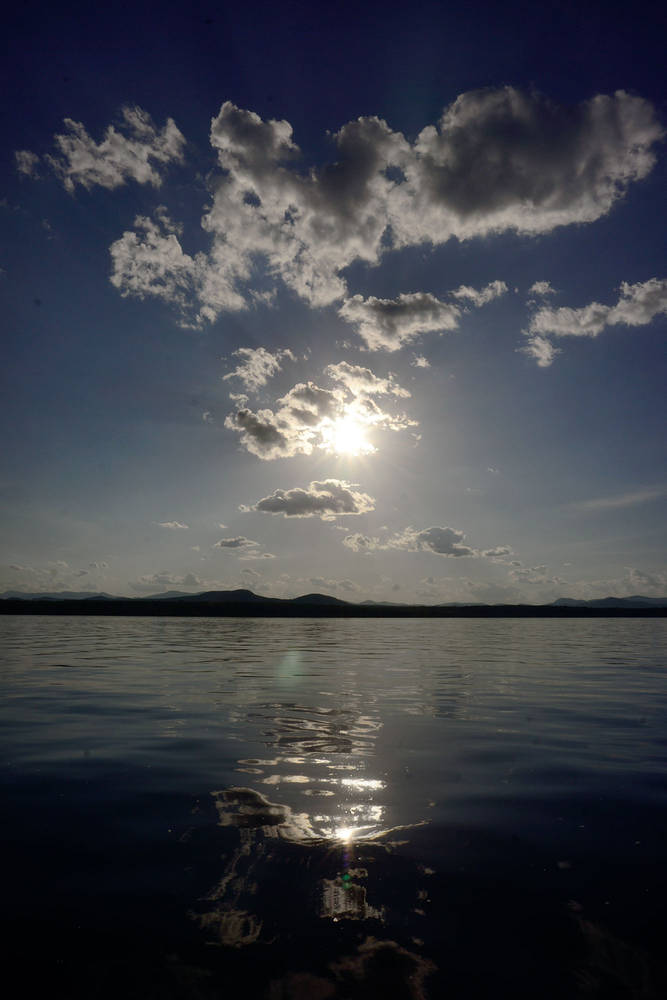 13.06_Lake-sun-cloudsSM by Maya Douglas